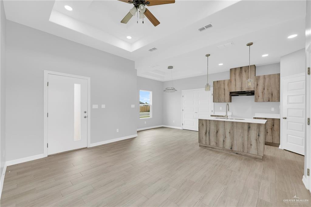 516 Bridget Street Weslaco, TX 78596 - Photo 5 of 24 a view of kitchen with stove and cabinets