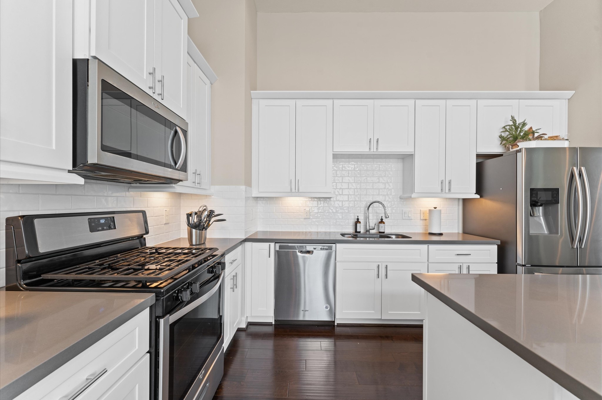 2422 Cochran Street Houston, TX 77009 - Photo 13 of 31 Crisp, white cabinets offer plenty of space for storage as well as a nice-sized pantry located to the right of the refrigerator.