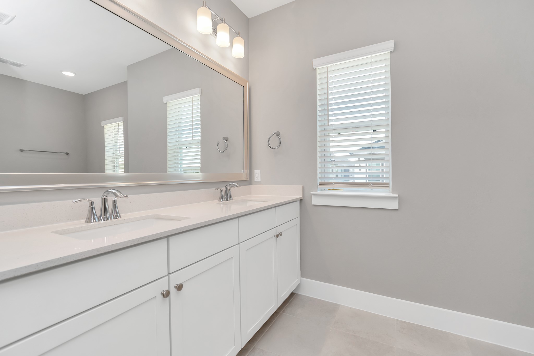 2717 Ruhman Flds Drive Houston, TX 77008 - Photo 18 of 43 a bathroom with a granite countertop sink mirror and next to a window