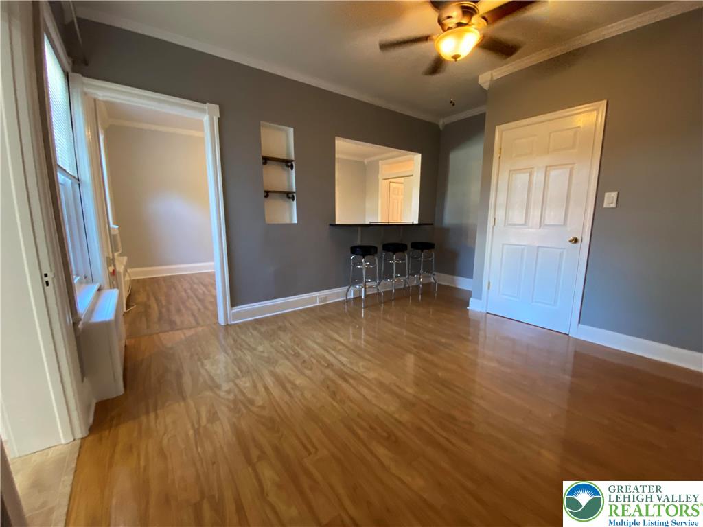 231 East Goepp Street, Unit 1 Bethlehem, PA 18018 - Photo 3 of 9 wooden floor in an empty room with a window