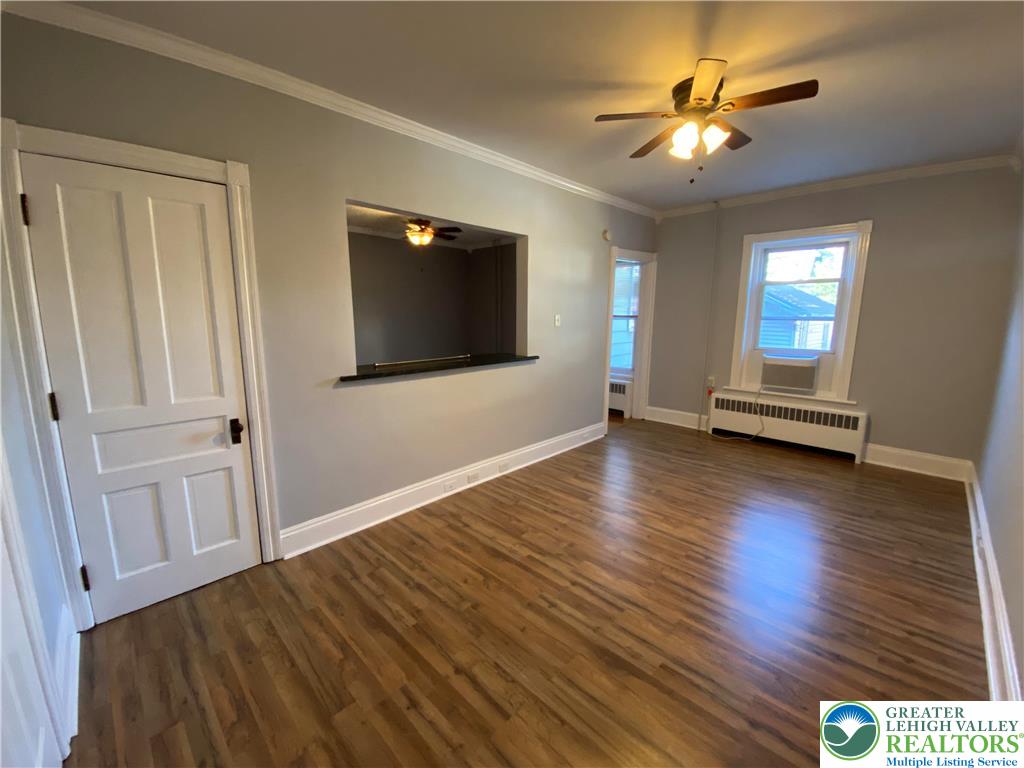 231 East Goepp Street, Unit 1 Bethlehem, PA 18018 - Photo 4 of 9 wooden floor in an empty room with a window