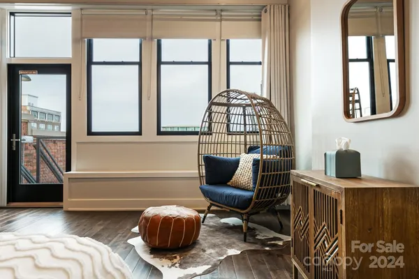 a bedroom with furniture and a window