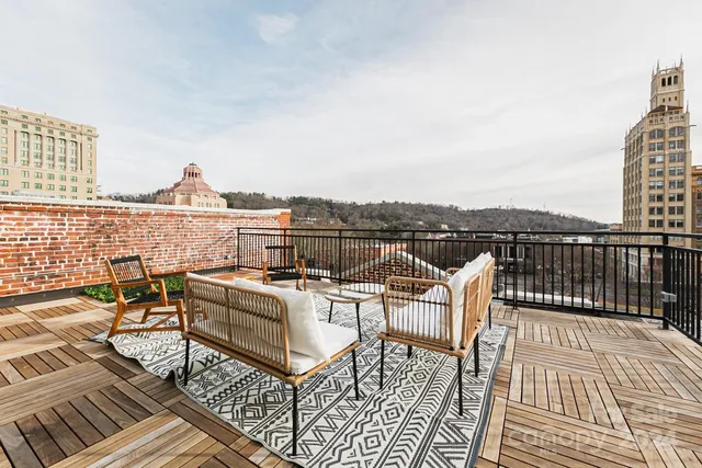 a view of a roof deck with couches