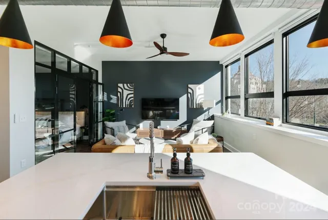 a view of living room with furniture and floor to ceiling window