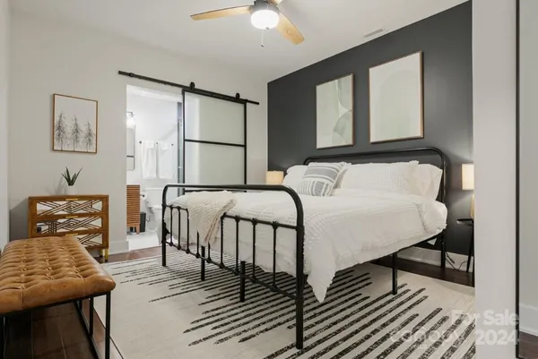 a bedroom with furniture and a window
