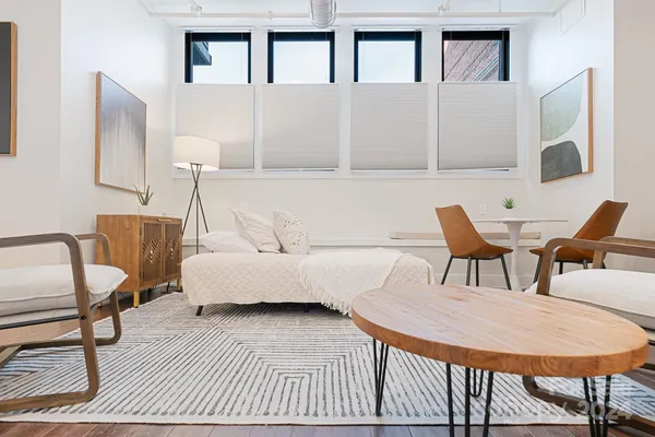 a living room with furniture and a table