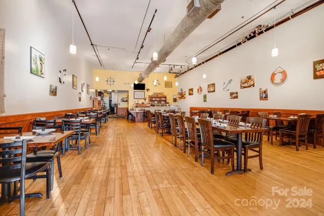 a outdoor space with lots of furniture and wooden floor