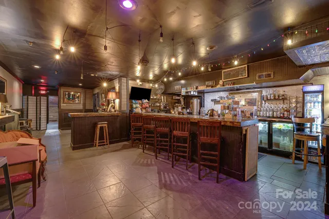 a room with lots of furniture and a flat screen tv