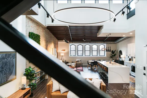 a kitchen with stainless steel appliances kitchen island granite countertop lots of counter top space