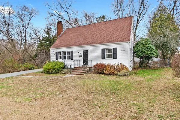 a house that has a sitting space in front of it