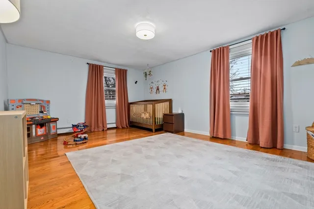 a view of a livingroom with furniture and a flat screen tv