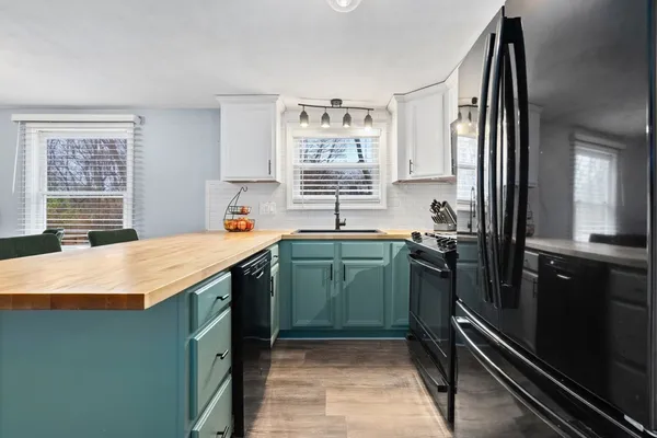 a kitchen with a sink and a refrigerator