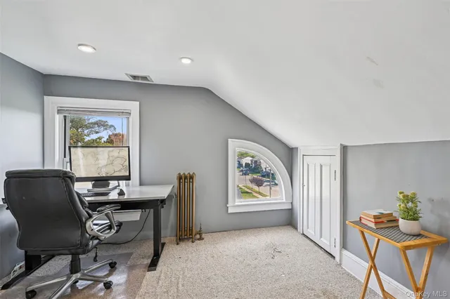 a workspace with furniture and window