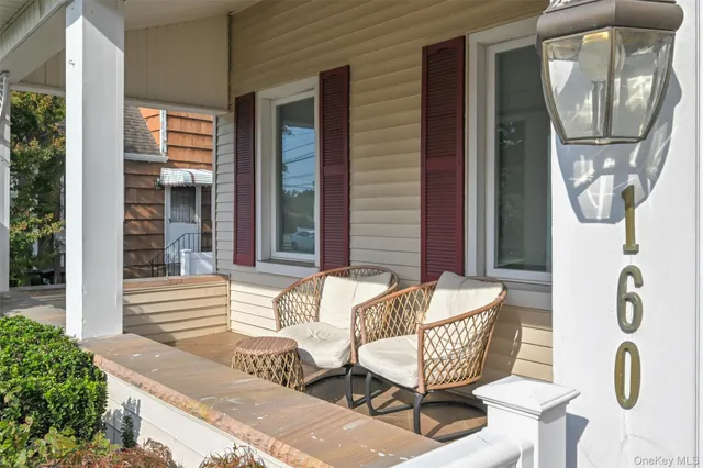 a front view of a house with a yard patio and fire pit