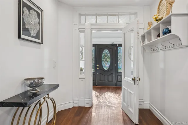 a view of entryway with wooden floor