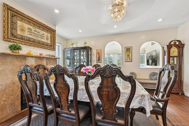 a view of a dining room with furniture and a window