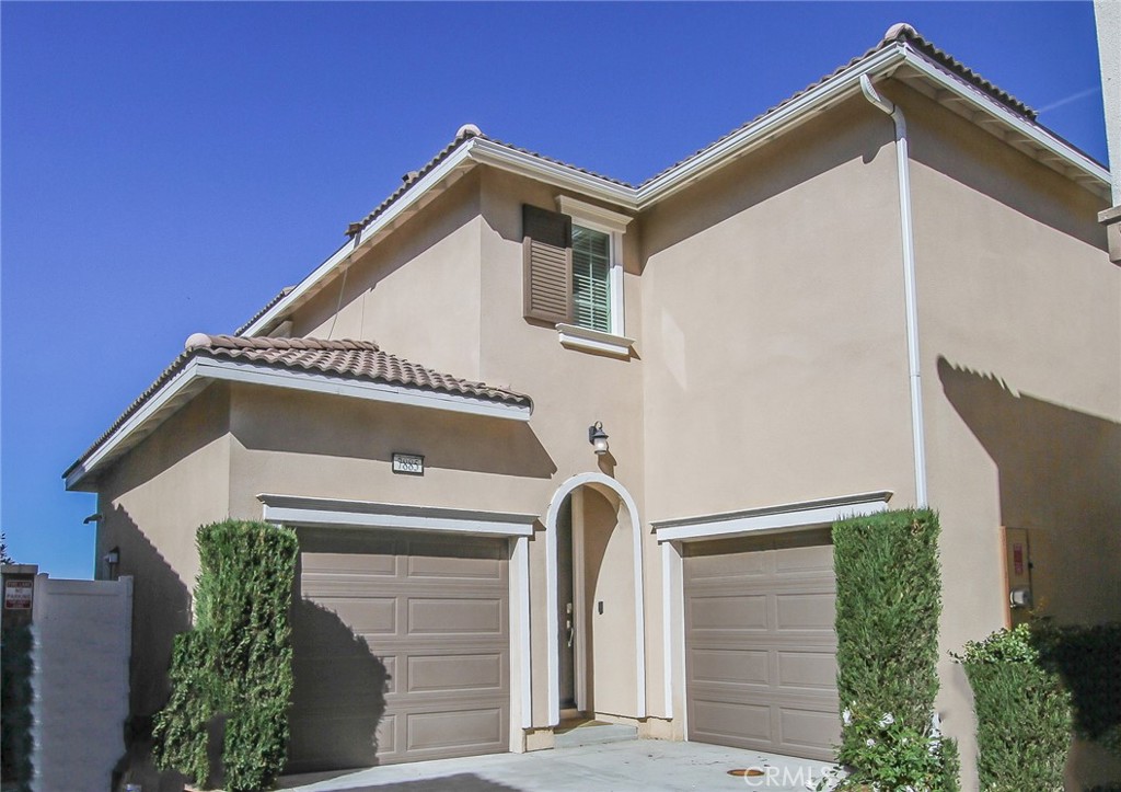 7885 Griffith Peak Street Riverside, CA 92507 - Photo 1 of 1 a front view of a house with a garage