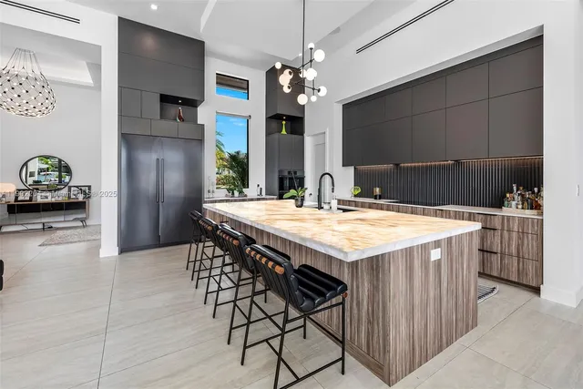 a kitchen with refrigerator and cabinets