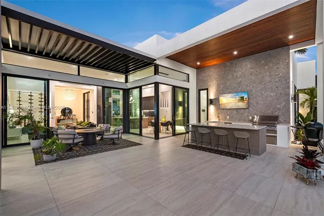 a lobby with furniture and floor to ceiling window