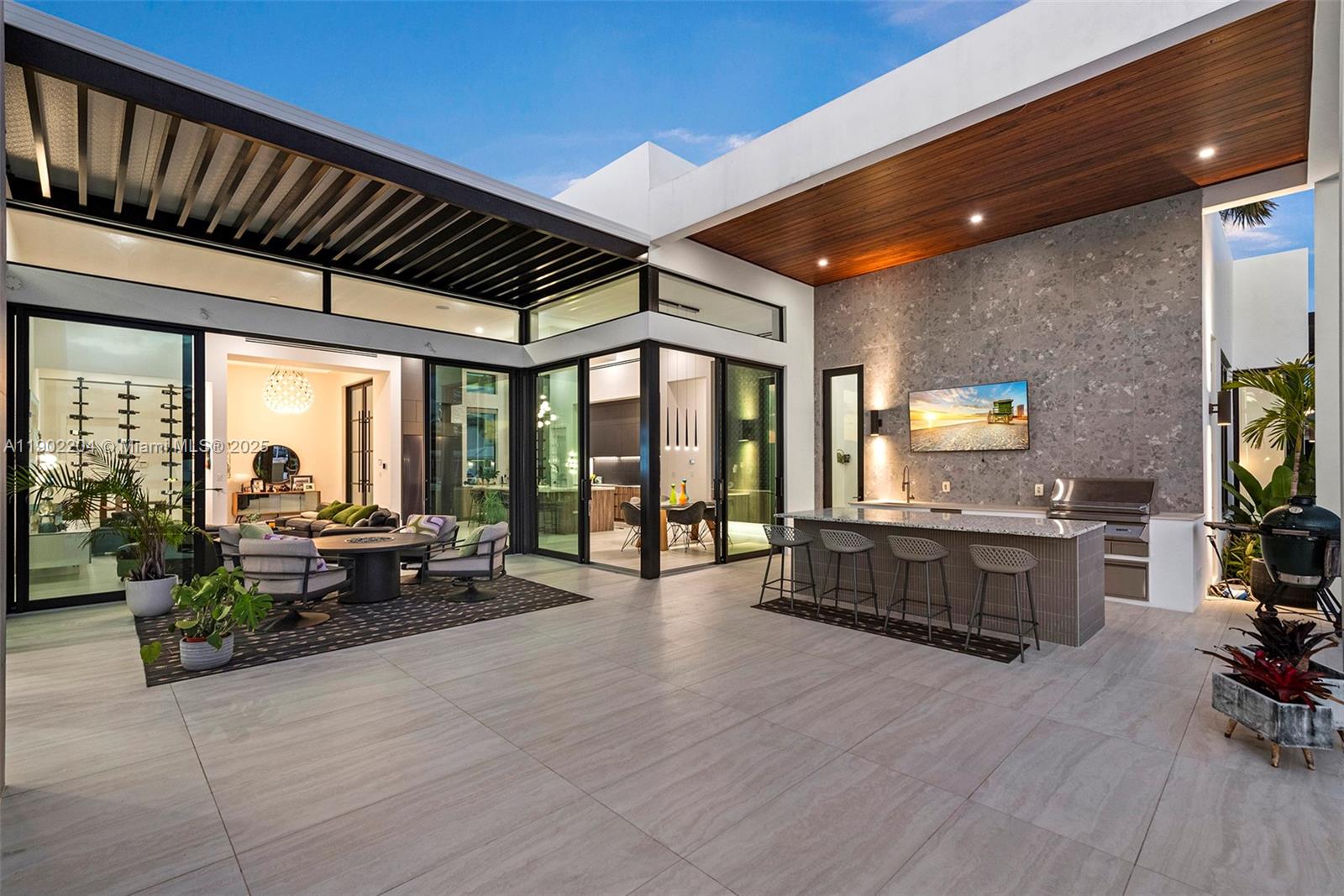 3701 Northeast 26th Avenue, Unit 1 Lighthouse Point, FL 33064 - Photo 23 of 46 a lobby with furniture and floor to ceiling window