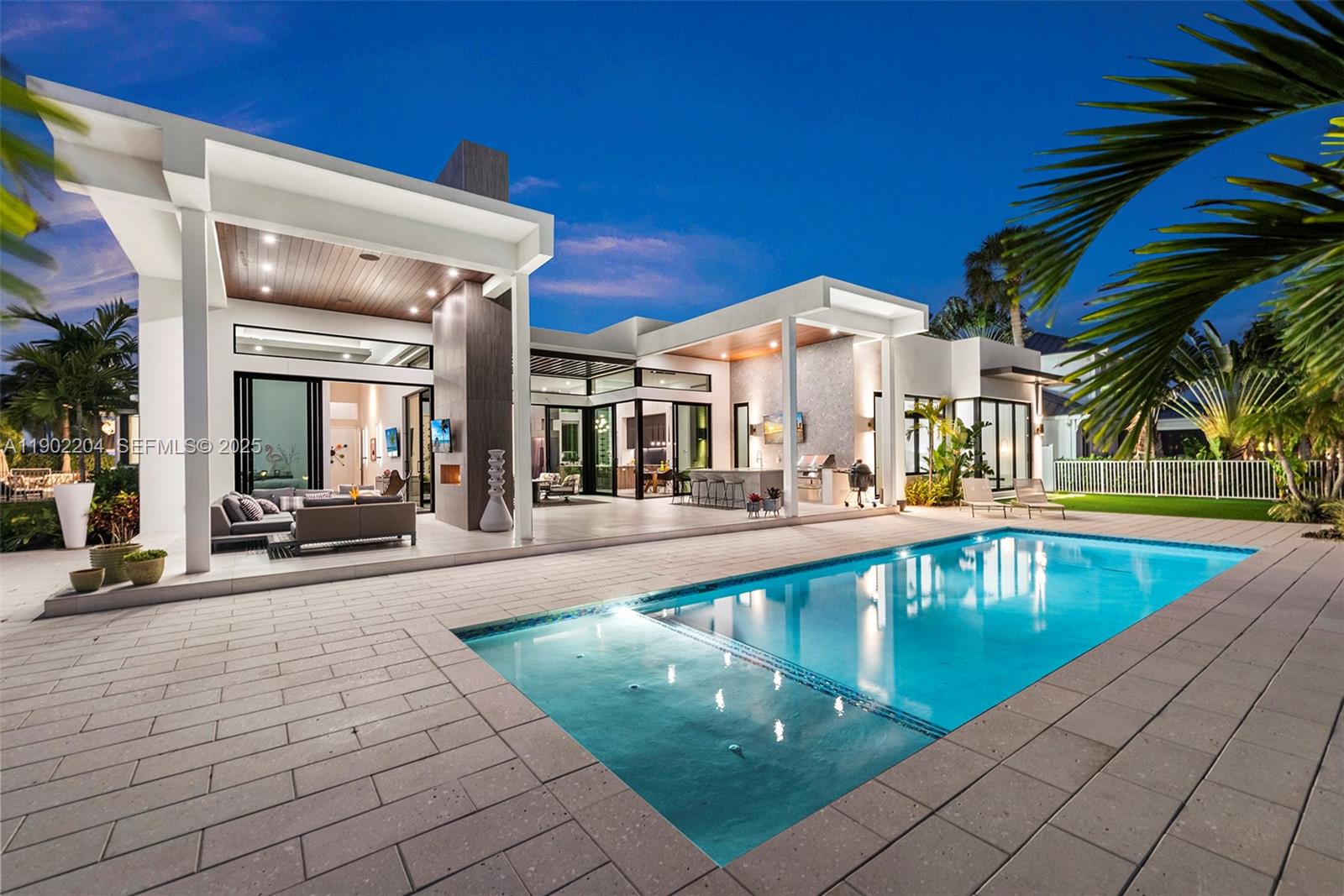 3701 Northeast 26th Avenue, Unit 1 Lighthouse Point, FL 33064 - Photo 29 of 46 a view of a swimming pool with sitting area