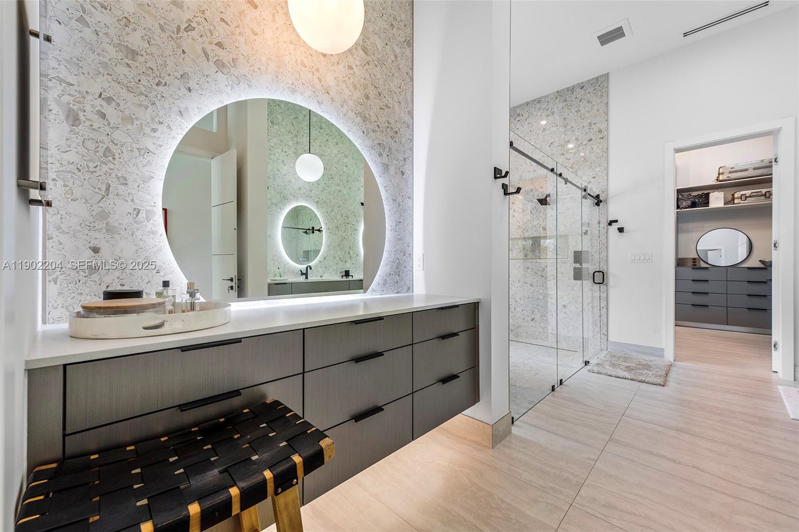 3701 Northeast 26th Avenue, Unit 1 Lighthouse Point, FL 33064 - Photo 33 of 46 a spacious bathroom with a sink and a mirror