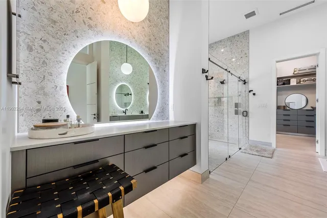 a spacious bathroom with a sink and a mirror