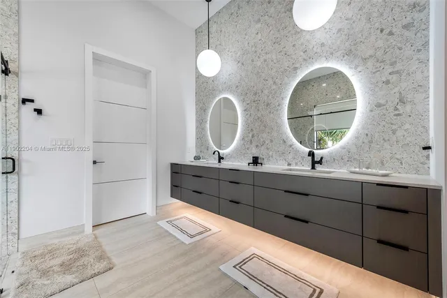 a bathroom with a double vanity sink and a mirror