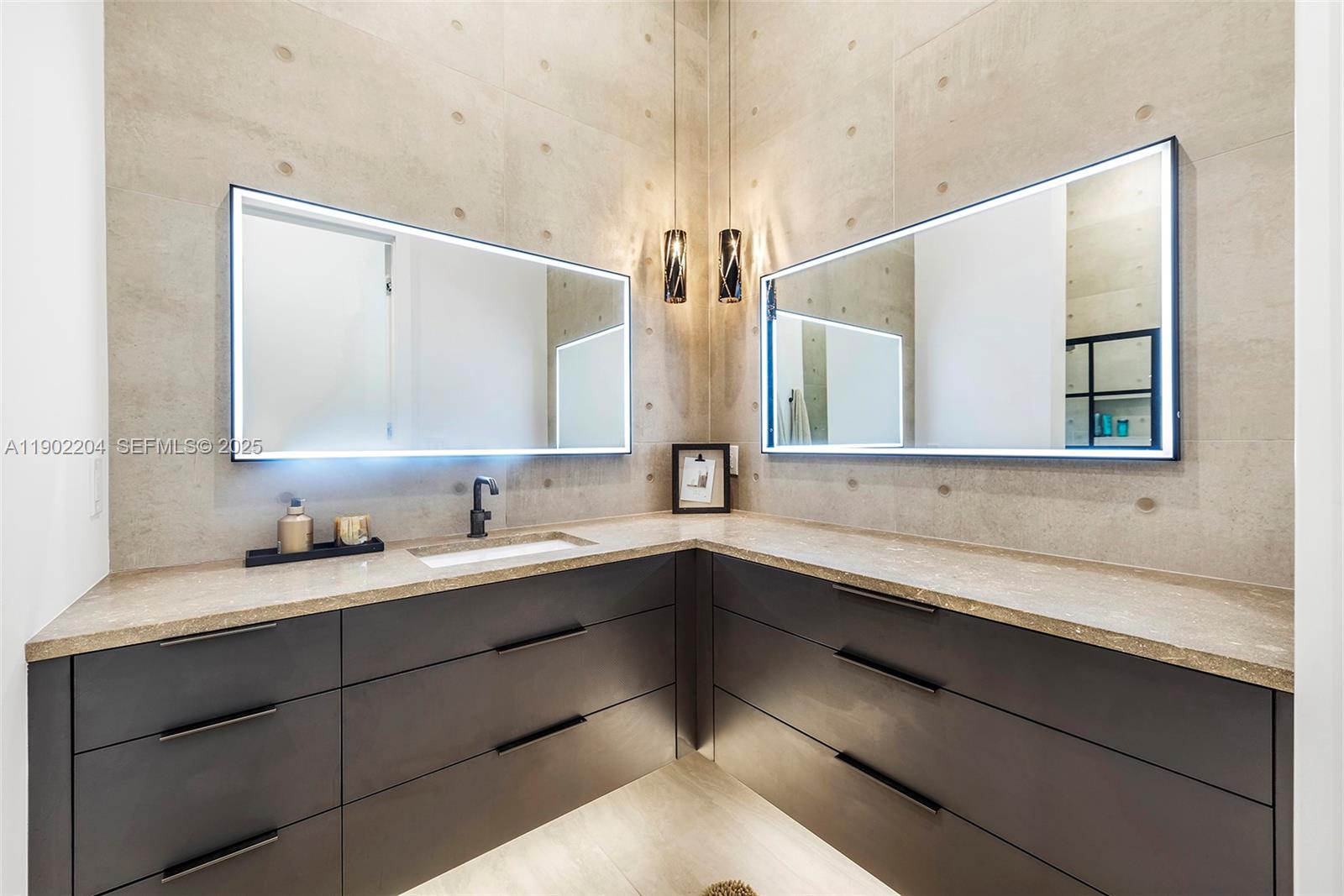3701 Northeast 26th Avenue, Unit 1 Lighthouse Point, FL 33064 - Photo 39 of 46 a bathroom with a double vanity sink and a mirror