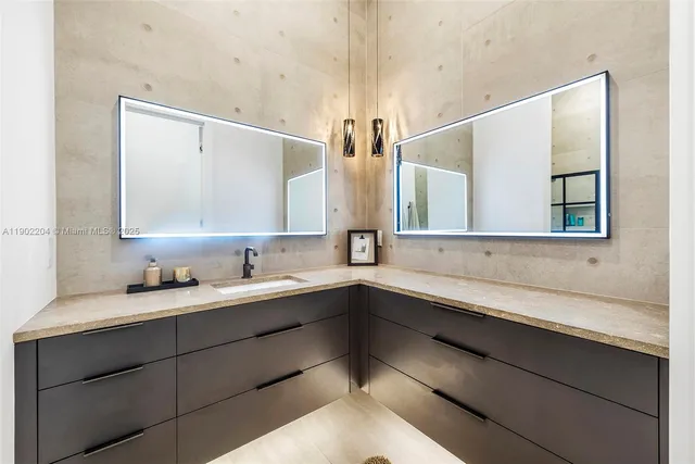 a bathroom with a double vanity sink and a mirror
