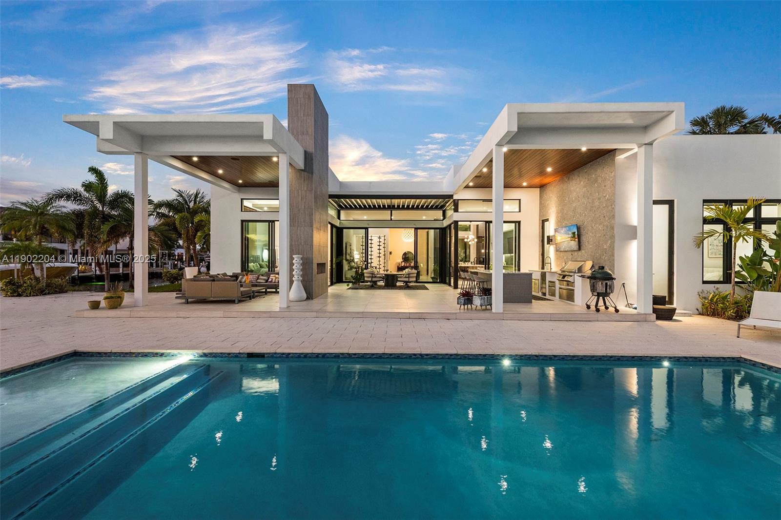 3701 Northeast 26th Avenue, Unit 1 Lighthouse Point, FL 33064 - Photo 6 of 46 a swimming pool with outdoor seating and yard