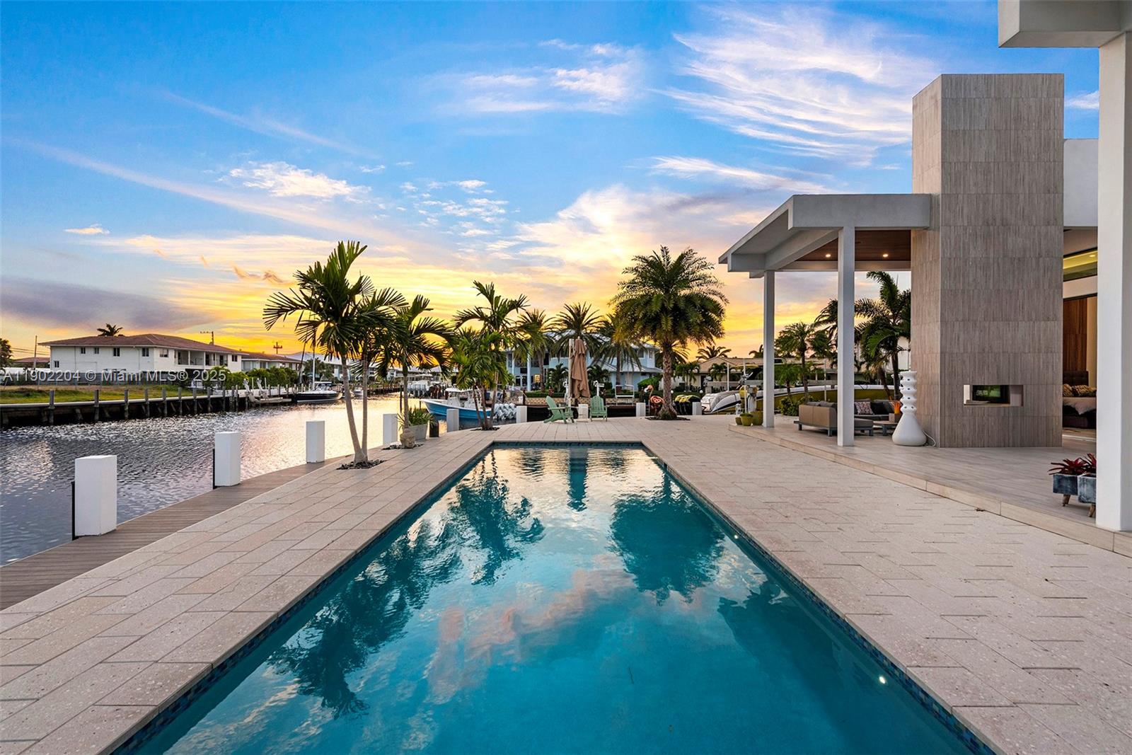 3701 Northeast 26th Avenue, Unit 1 Lighthouse Point, FL 33064 - Photo 7 of 46 a view of a swimming pool with lounge chair