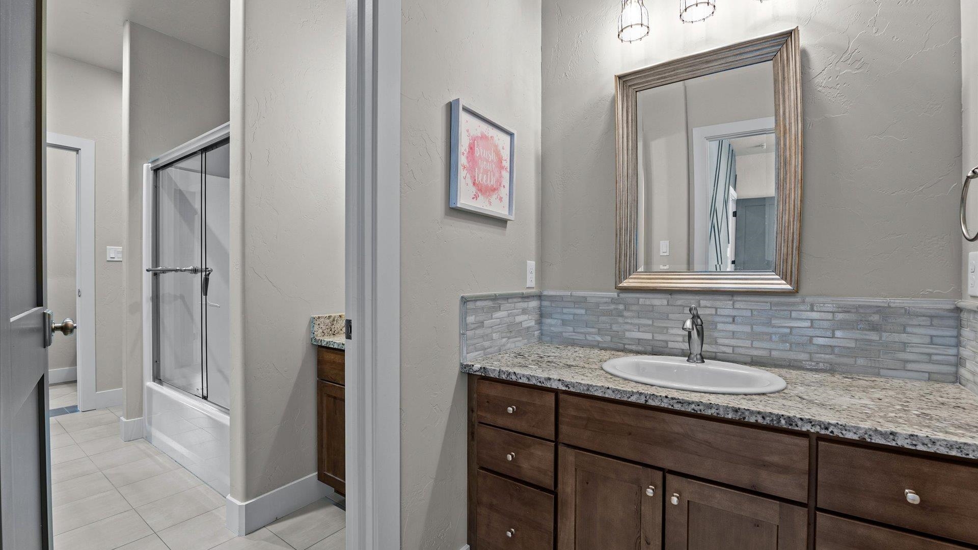 2041 J J 1/2 Road Fruita, CO 81521 - Photo 28 of 42 a bathroom with a sink and a mirror