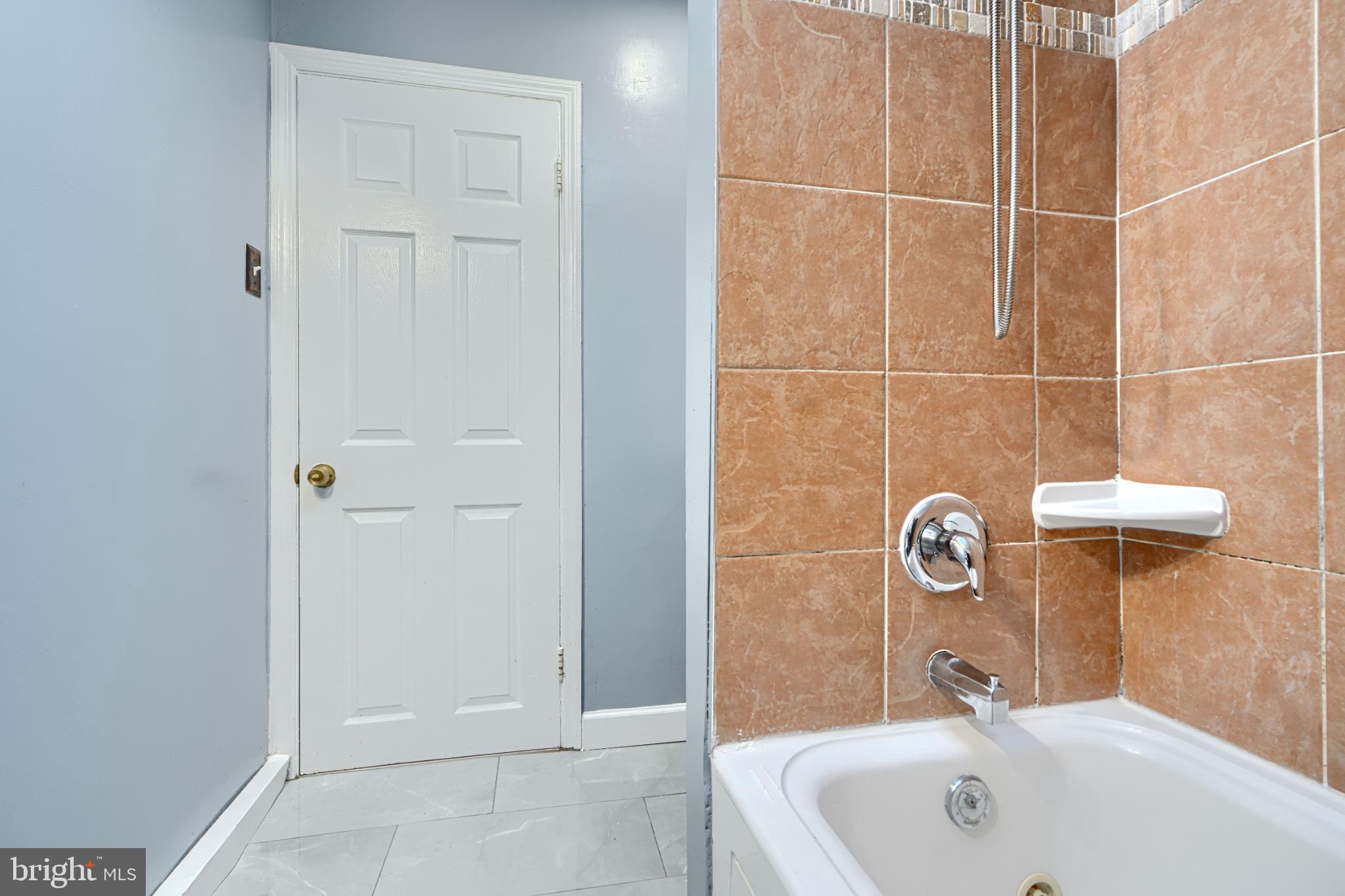 1236 Primrose Avenue Rosedale, MD 21237 - Photo 24 of 39 a bathroom with a sink and mirror
