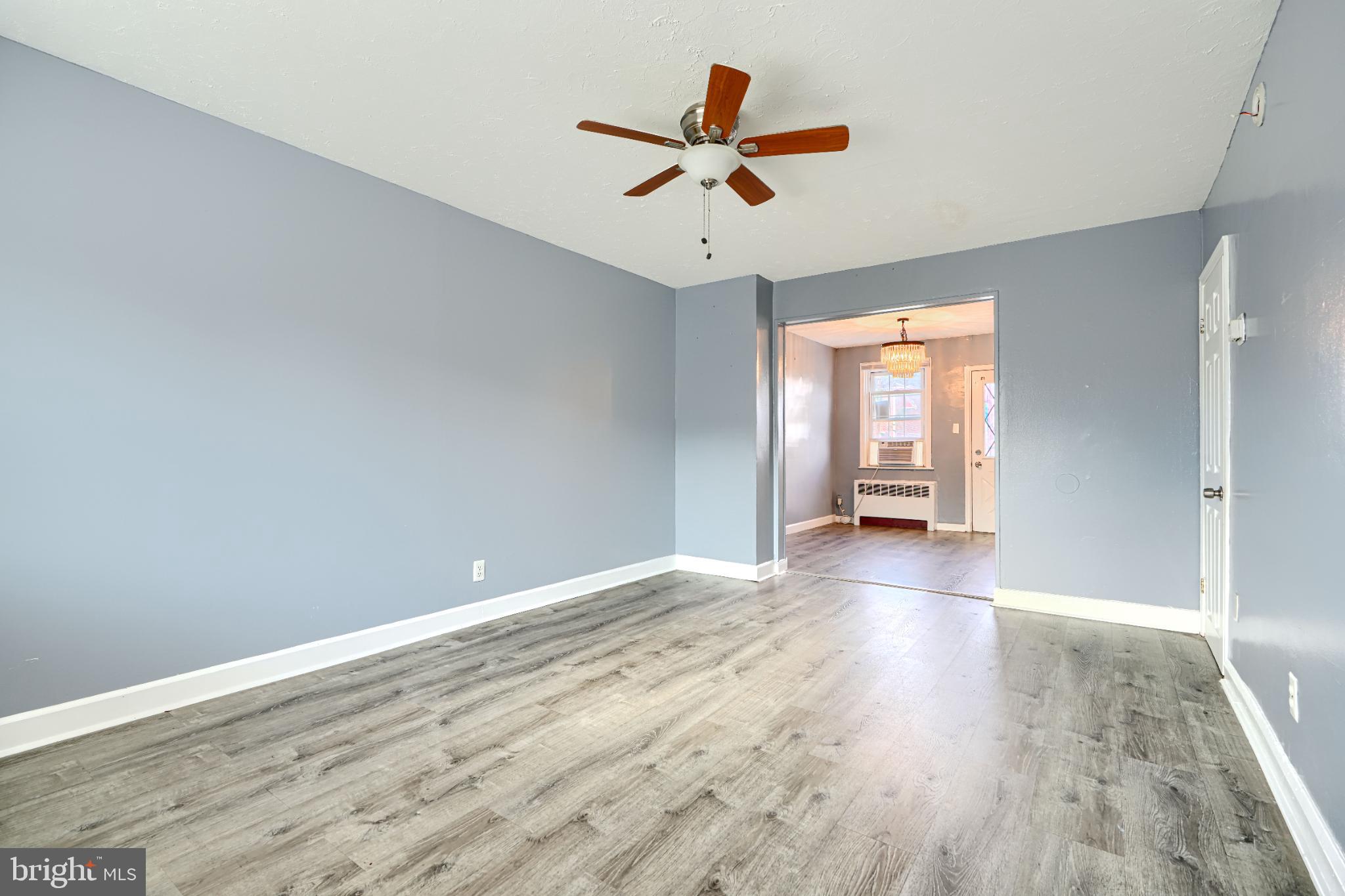 1236 Primrose Avenue Rosedale, MD 21237 - Photo 5 of 39 wooden floor in an empty room with a window