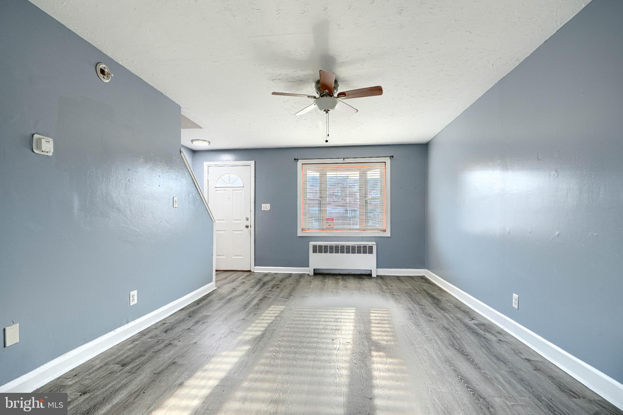 1236 Primrose Avenue Rosedale, MD 21237 - Photo 7 of 39 wooden floor in an empty room with a window