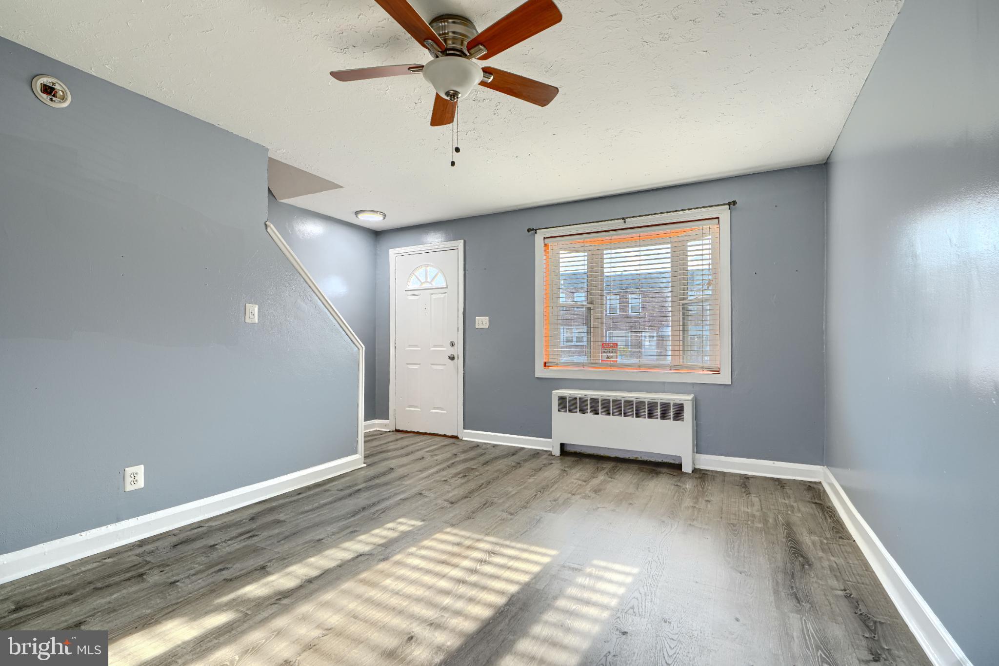 1236 Primrose Avenue Rosedale, MD 21237 - Photo 8 of 39 wooden floor in an empty room with a window