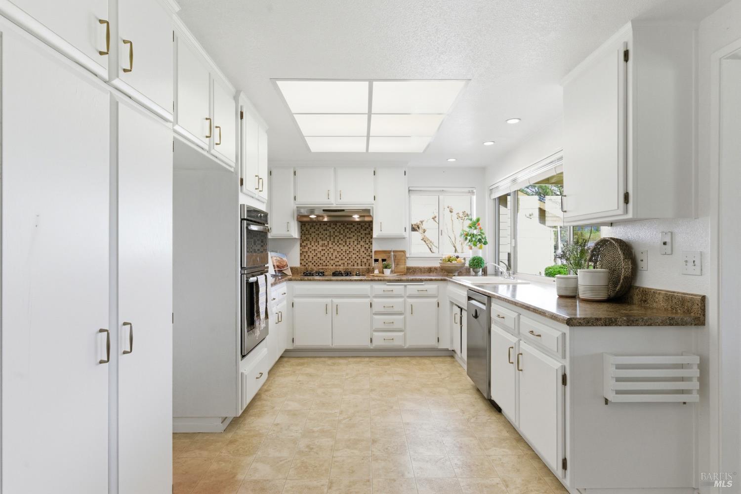 347 Twin Lakes Drive Santa Rosa, CA 95409 - Photo 13 of 47 a kitchen with cabinets and window