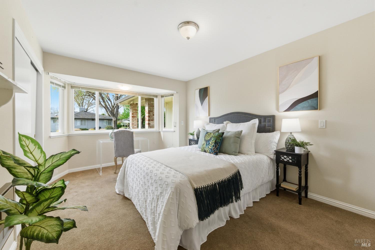 347 Twin Lakes Drive Santa Rosa, CA 95409 - Photo 22 of 47 a bedroom with a bed and large windows