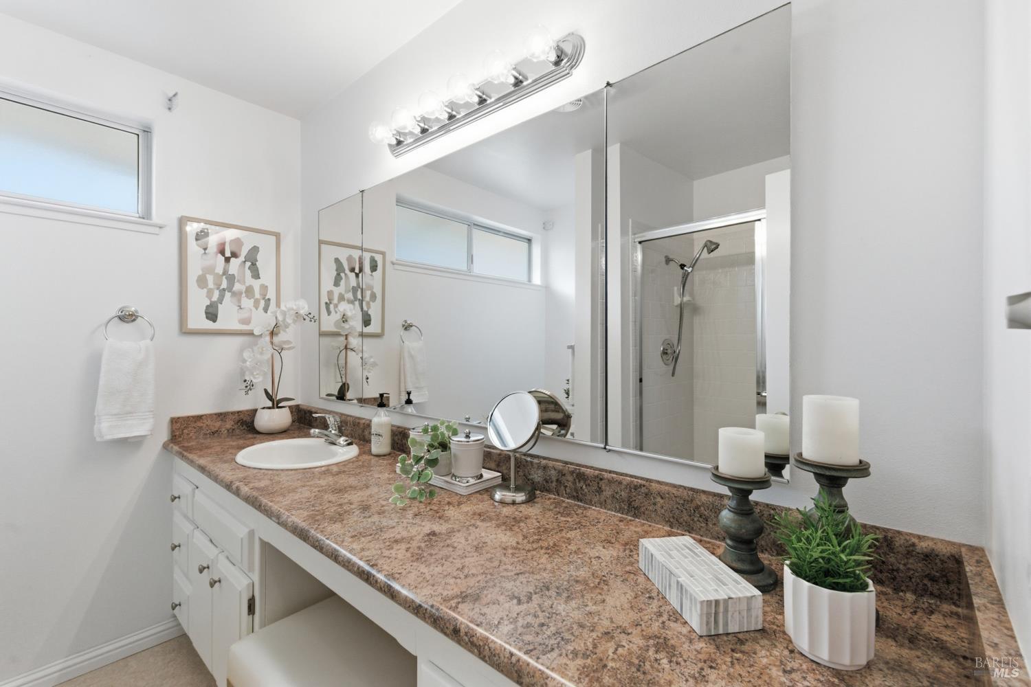 347 Twin Lakes Drive Santa Rosa, CA 95409 - Photo 24 of 47 a bathroom with a granite countertop sink and a mirror