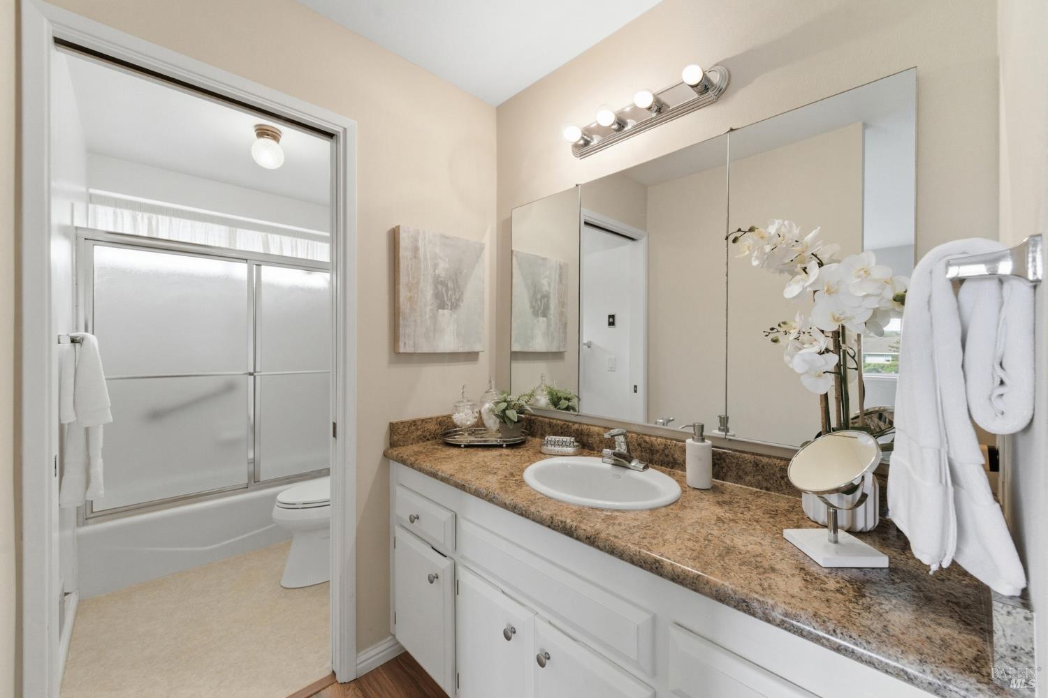 347 Twin Lakes Drive Santa Rosa, CA 95409 - Photo 30 of 47 a spacious bathroom with a granite countertop sink toilet and shower