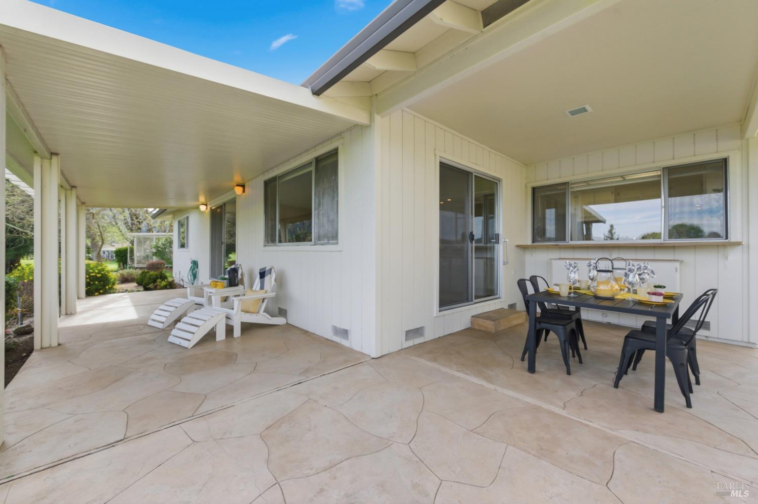 347 Twin Lakes Drive Santa Rosa, CA 95409 - Photo 37 of 47 a view of a patio with dining table and chairs