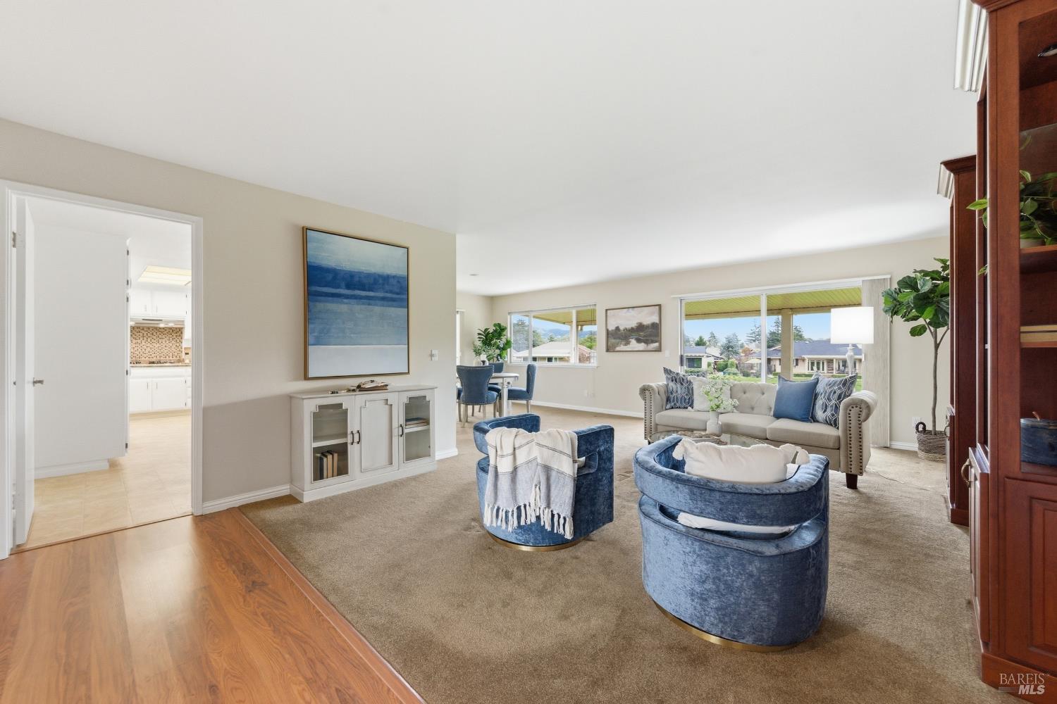 347 Twin Lakes Drive Santa Rosa, CA 95409 - Photo 6 of 47 a living room with furniture a large window and a wooden floor