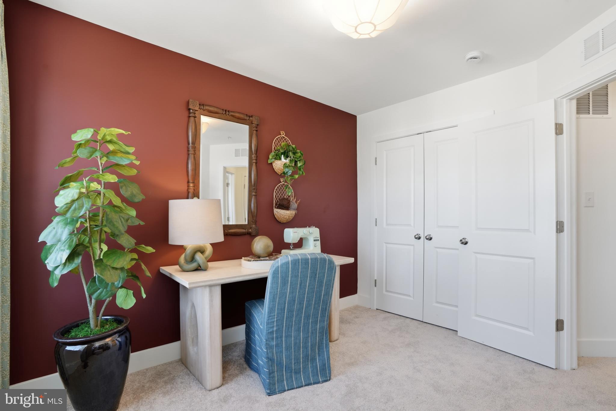 7610 River Reach Road Baltimore, MD 21244 - Photo 13 of 16 a dining room with furniture and a potted plant