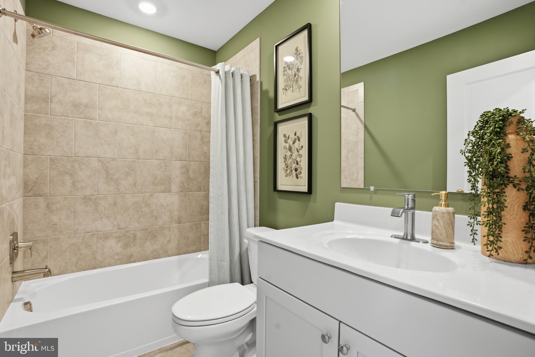 7610 River Reach Road Baltimore, MD 21244 - Photo 14 of 16 a bathroom with a sink a toilet and shower