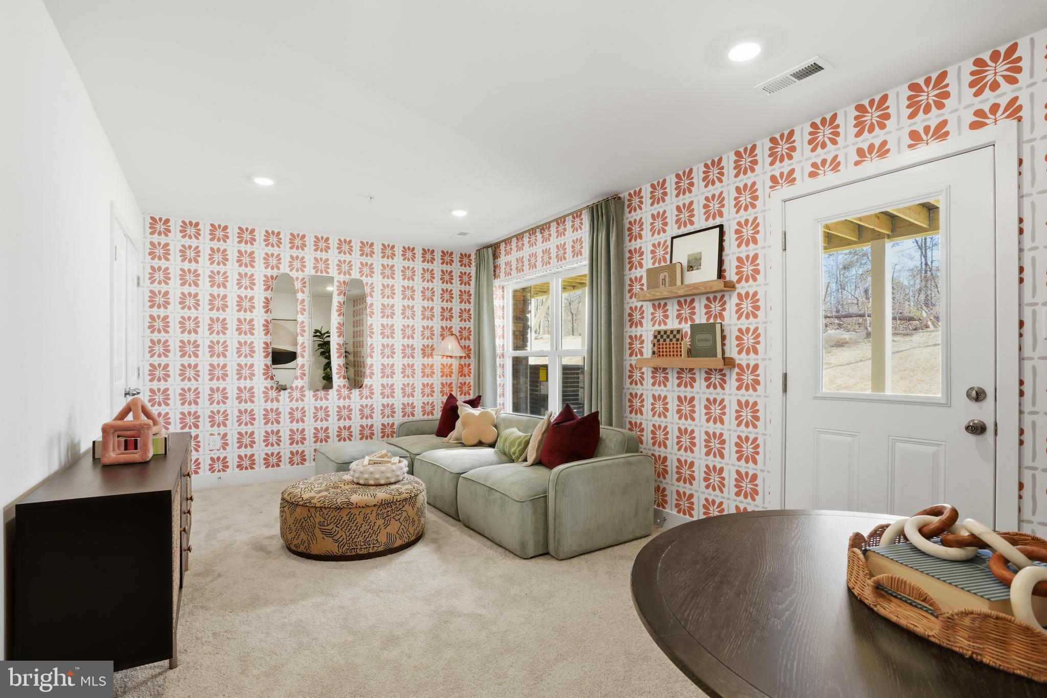 7610 River Reach Road Baltimore, MD 21244 - Photo 15 of 16 a living room with furniture and a floor to ceiling window