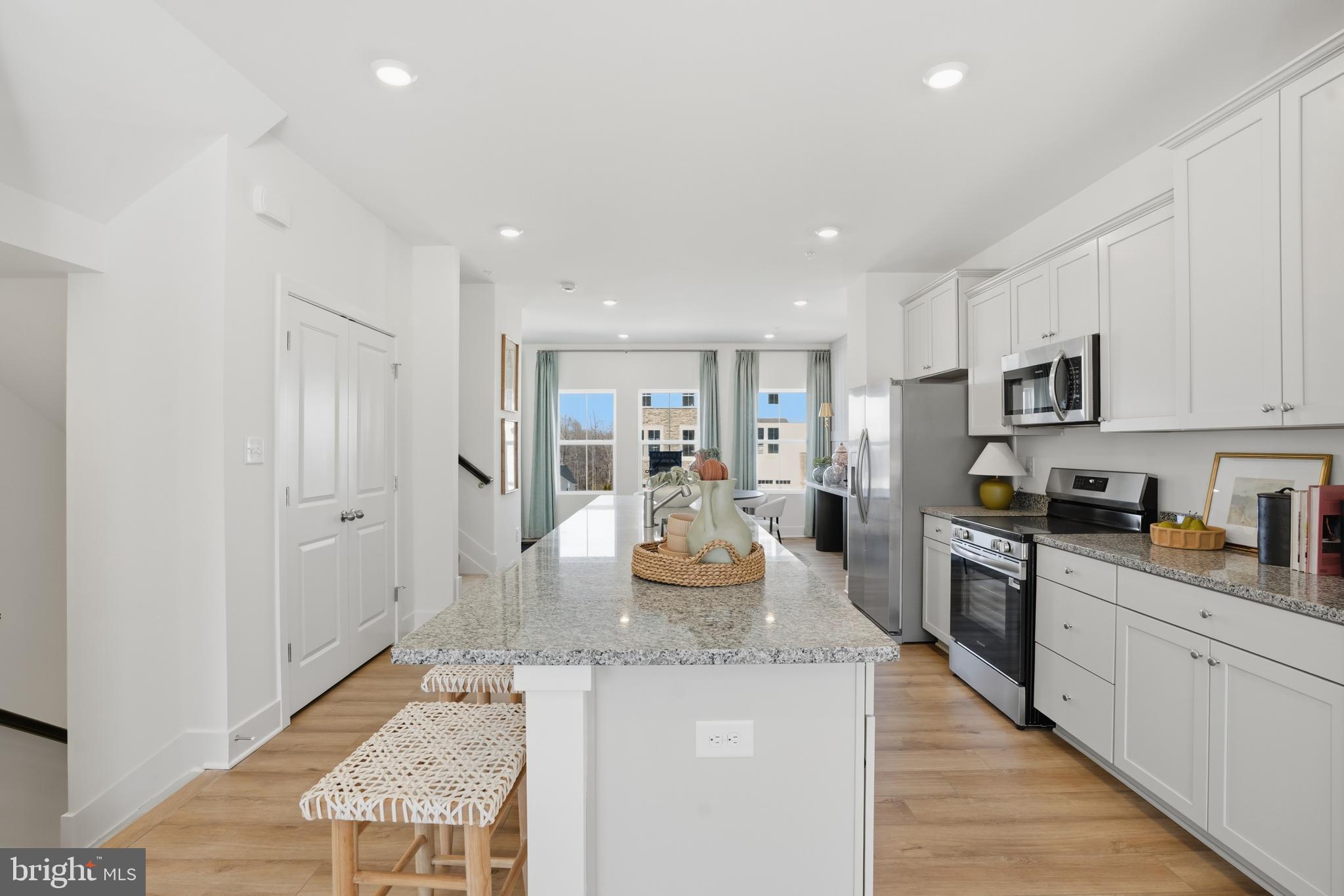 7610 River Reach Road Baltimore, MD 21244 - Photo 3 of 16 a kitchen with granite countertop lots of counter top space