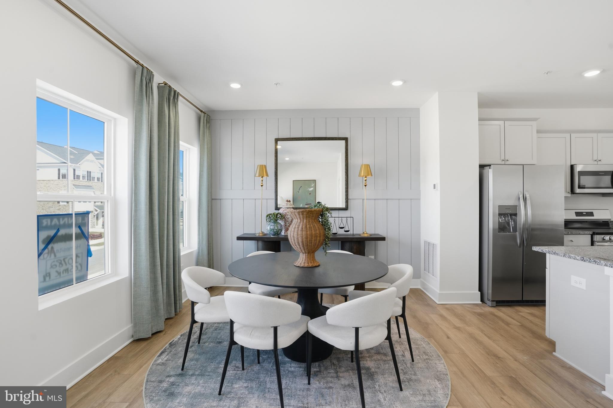 7610 River Reach Road Baltimore, MD 21244 - Photo 4 of 16 a dining room with furniture and window