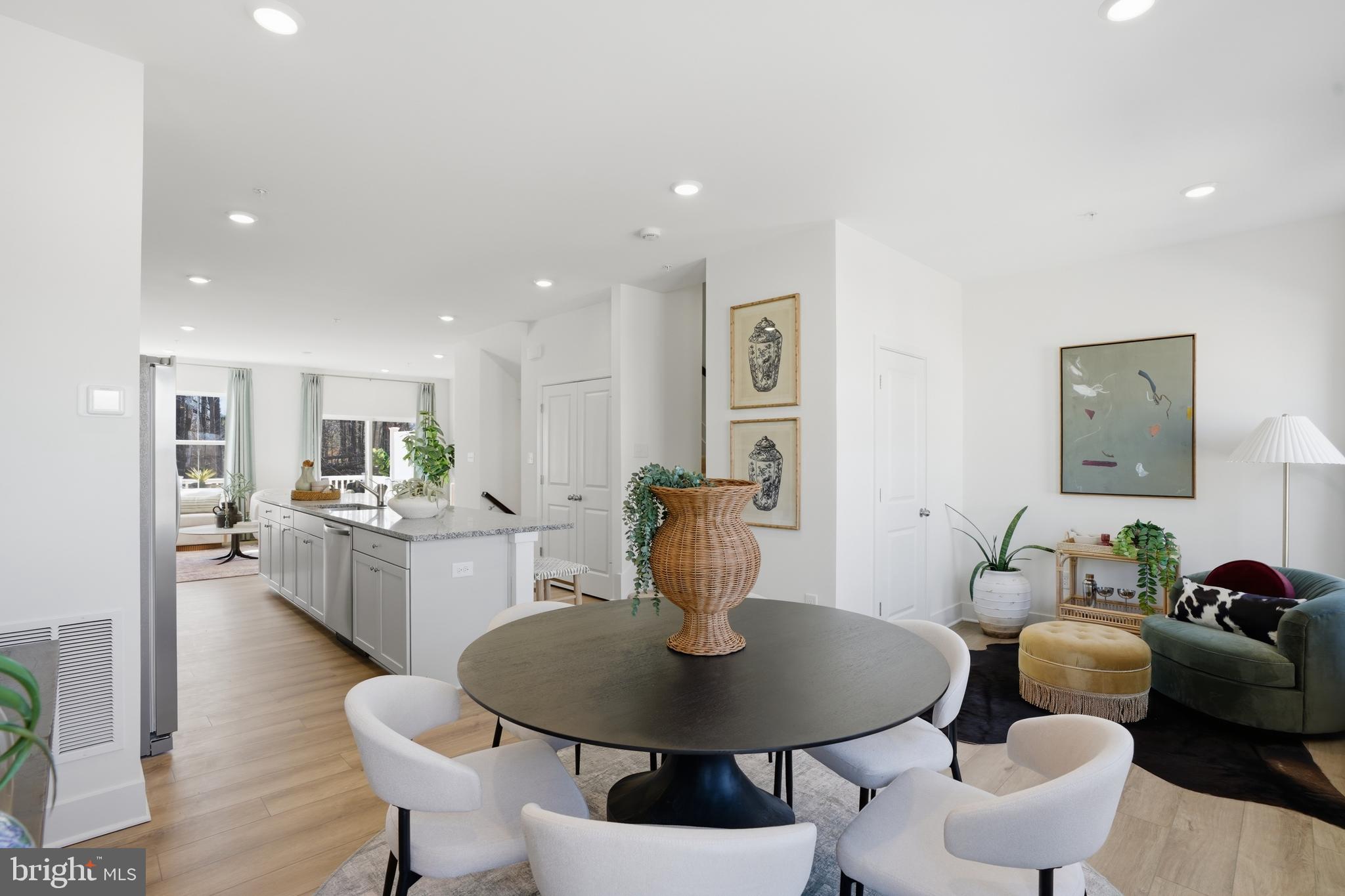 7610 River Reach Road Baltimore, MD 21244 - Photo 5 of 16 a dining room with furniture and wooden floor