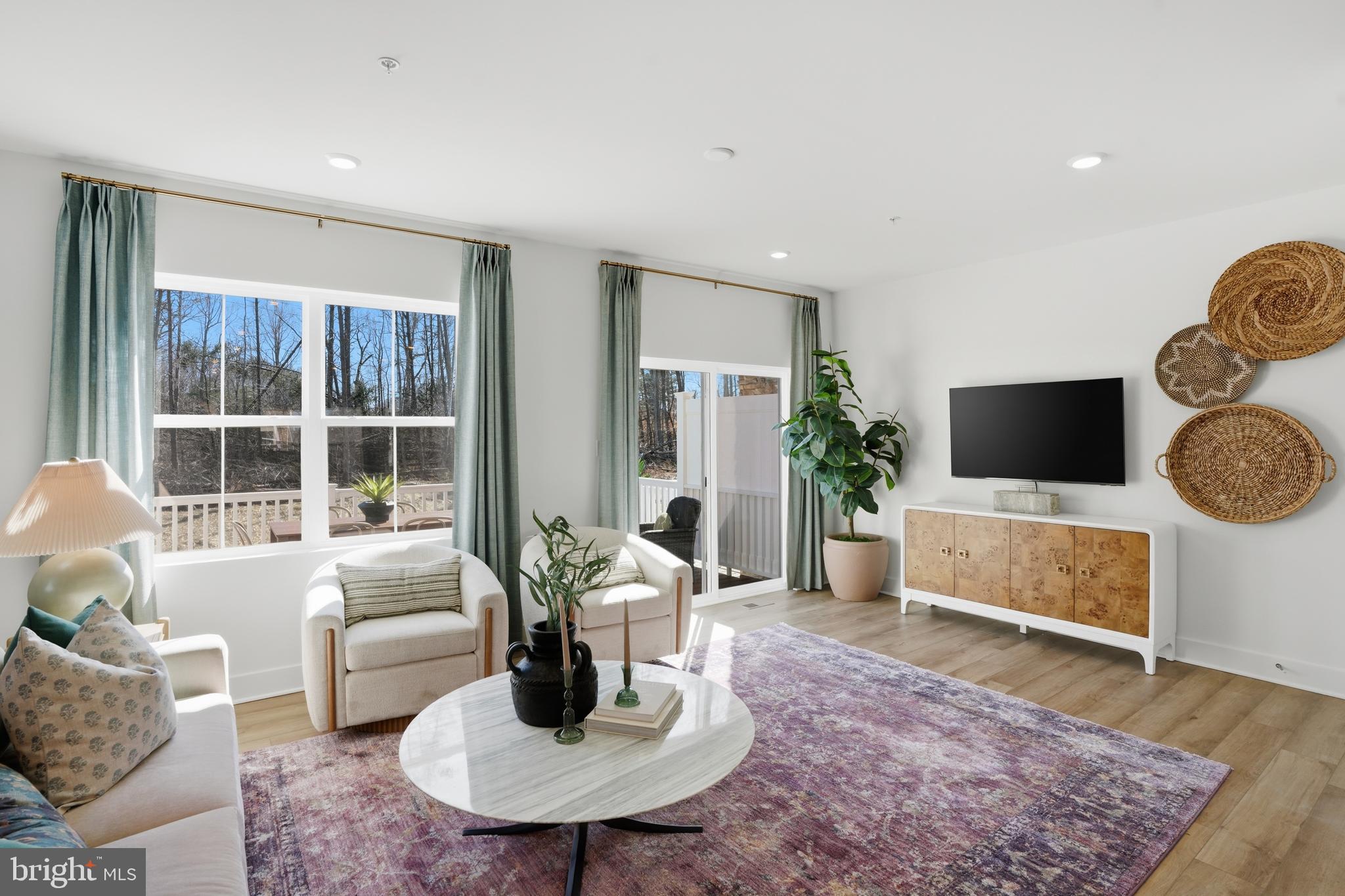 7610 River Reach Road Baltimore, MD 21244 - Photo 6 of 16 a living room with furniture and a flat screen tv